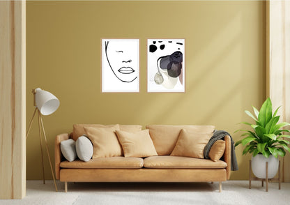 Minimalist Line Art Face and Abstract Expressionist Print Set (2 framed pieces) over a gold sofa. Perfect modern living room wall decor and contemporary art trends.