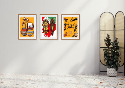 African Folk Art Triptych Wall Art Set (3 framed prints) in bright orange, red, and black. Features Tribal Masks, Pottery Still Life, and Hunting Silhouettes.
