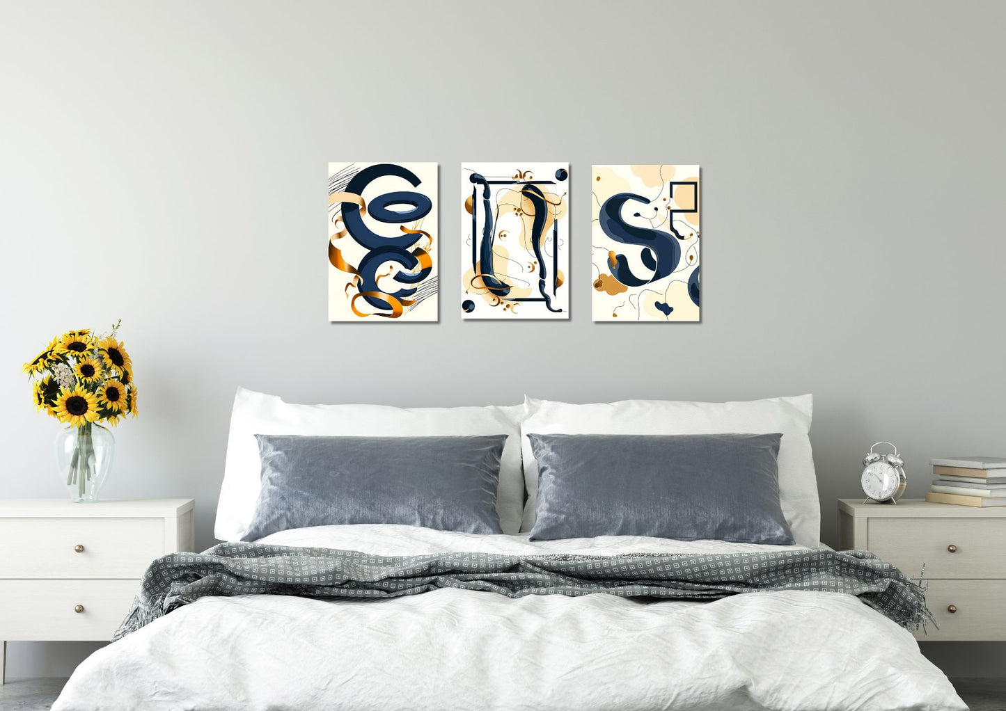 A triptych of three vertical abstract graphic artworks. Each piece features fluid, coiled, ribbon-like shapes in deep navy blue and ochre/gold, often intertwined with thin, black geometric rectangular outlines that sometimes contain or interact with the curves, all set against a pale cream background. Canvas wall art in a bed room by wall and more