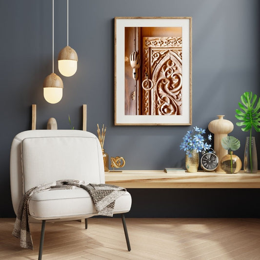Vertical framed Andalusian Craftsmanship Photography print featuring a close-up of intricate Carved Wooden Door with arabesque and Geometric Motifs. Ideal Bohemian or Moroccan Decor accent.