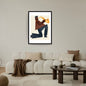 Vertical framed Minimalist Geometric Figurative Wall Art print of a kneeling Jazz Musician playing a Saxophone in brown, blue, and yellow blocks. Ideal Music Studio Decor or Contemporary Living Room accent.