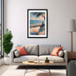 Modern living room with a gray sofa, coffee table, and framed artwork of a beach scene.
