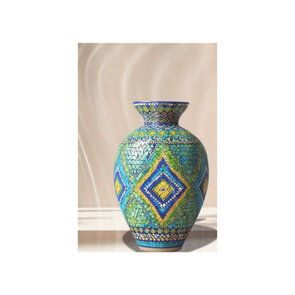 Decorative mosaic vase with geometric pattern on a neutral background