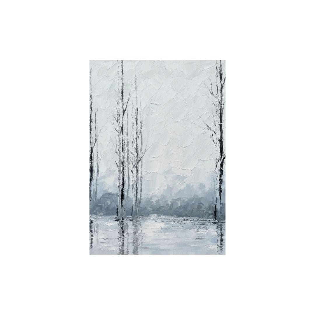 Winter landscape with bare trees reflected in a snowy lake