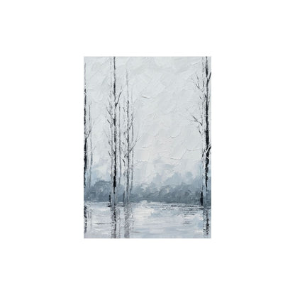 Winter landscape with bare trees reflected in a snowy lake