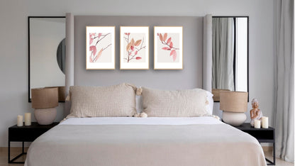 Minimalist Botanical Triptych Wall Art Set (3 prints) of delicate pink and rust-colored branches/leaves. Ideal for Boho or Scandinavian bedroom decor and oversize headboards.