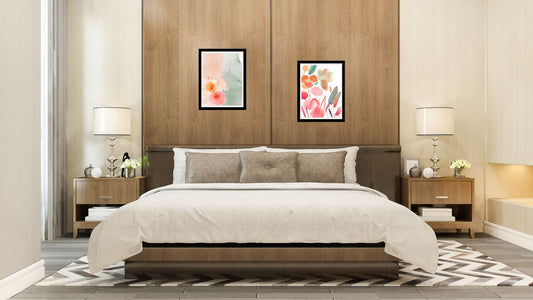 Abstract Watercolor-like Floral Diptych Wall Art Set (2 framed prints) in bright pink, orange, and sage green. Perfect Botanical and Bohemian Bedroom Decor over a wooden headboard.
