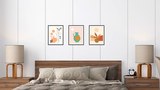 Minimalist Boho Triptych Wall Art Set (3 prints) featuring abstract pots, a turquoise jug, and botanical shapes in warm earth tones. Ideal Bedroom Decor over a wooden headboard.