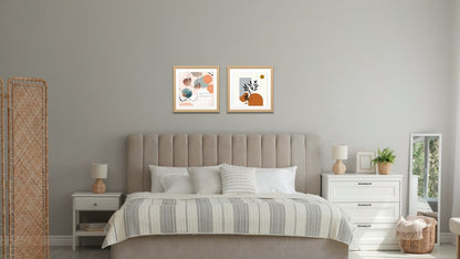 A diptych of two contemporary abstract artworks in a cohesive palette of burnt orange, dusty blue-gray, and peach. The left piece features overlapping watercolor-like organic shapes, delicate black lines, and dots on a pale pink background. The right piece features solid, flat shapes and a silhouette of a dark green botanical branch against a pale background with a burnt orange sun, by wall and more