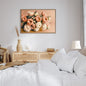 Horizontal framed Modern Botanical Wall Art print featuring a lush bouquet of delicate Pink and Peach Flowers (Ranunculus/Peonies) on a subtle beige background. Ideal Bedroom Decor or Feminine Living Room accent.