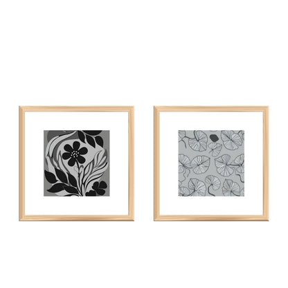 Monochromatic Botanical Diptych Framed Wall Art Set (2 square prints) featuring Stylized Black and White Flower Illustration and a subtle moth/butterfly pattern. Ideal For Modern Bedroom Decor.