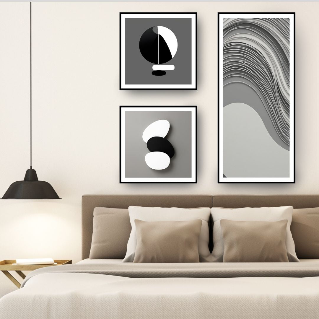 Monochromatic Abstract Art Set (3 framed prints) featuring minimalist black, white, and gray geometric shapes, including a long panel with Wavy Lines and two square panels with stacked forms. Ideal Modern Bedroom Decor.