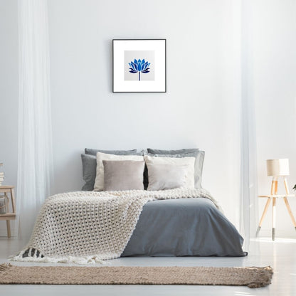 Square framed Minimalist Geometric Wall Art print featuring a stylized, symmetrical Blue Lotus Flower. Ideal Zen, Spa, Yoga Studio, or Modern Bedroom Decor accent.