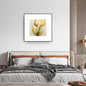Vertical framed Lyrical Botanical Abstract print featuring a stylized flower/sprout in glowing Yellow, Orange, and Lime Green tones with expressive, sketch-like lines. Ideal Zen, Bohemian, or Modern Bedroom Decor.