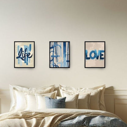 Three framed prints on a wall above a bed with 'Life' and 'Love' text.