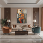 Large figurative canvas wall art depicting a woman playing the cello in warm earth tones, displayed above a sofa in a luxury living room